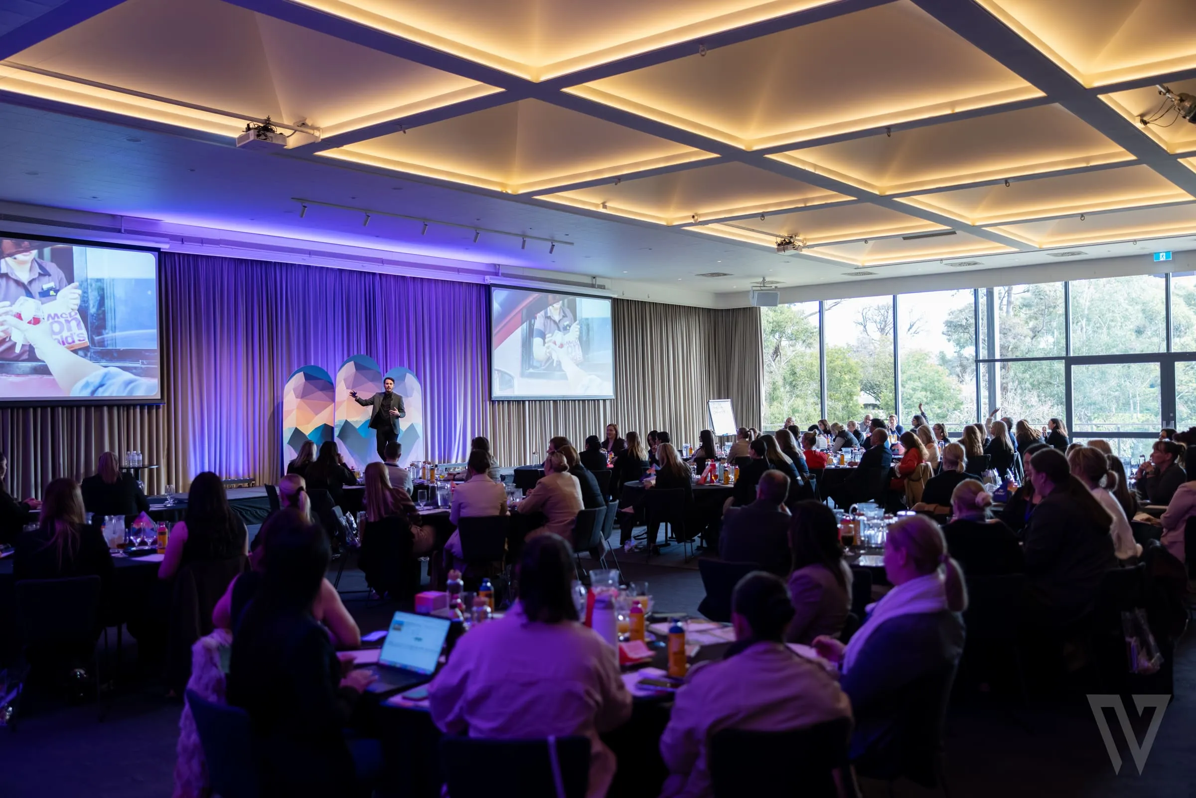 Presenting to the room at the PM Summit 2025