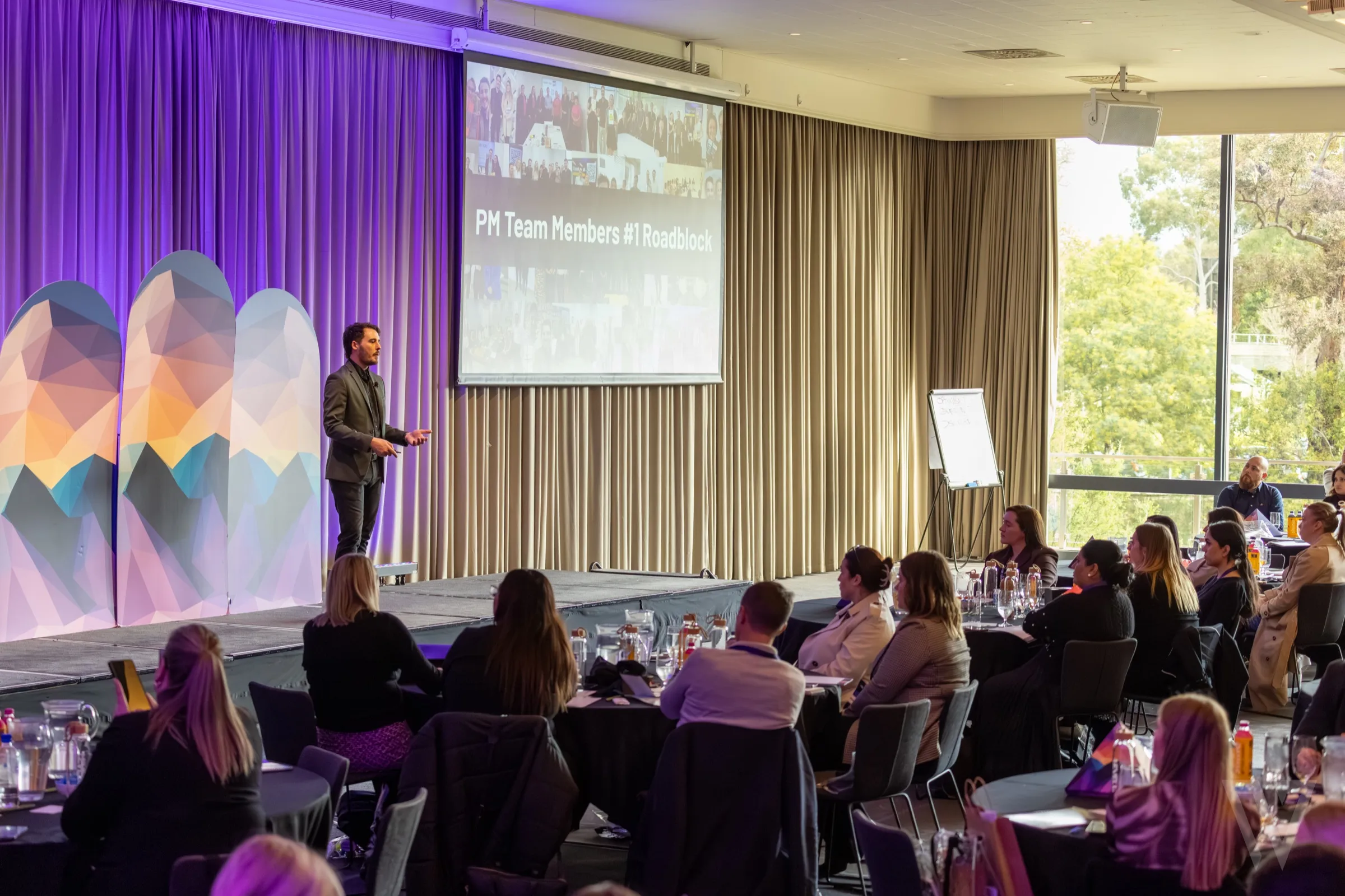 Joe Shannon on stage presenting at a TEC industry event