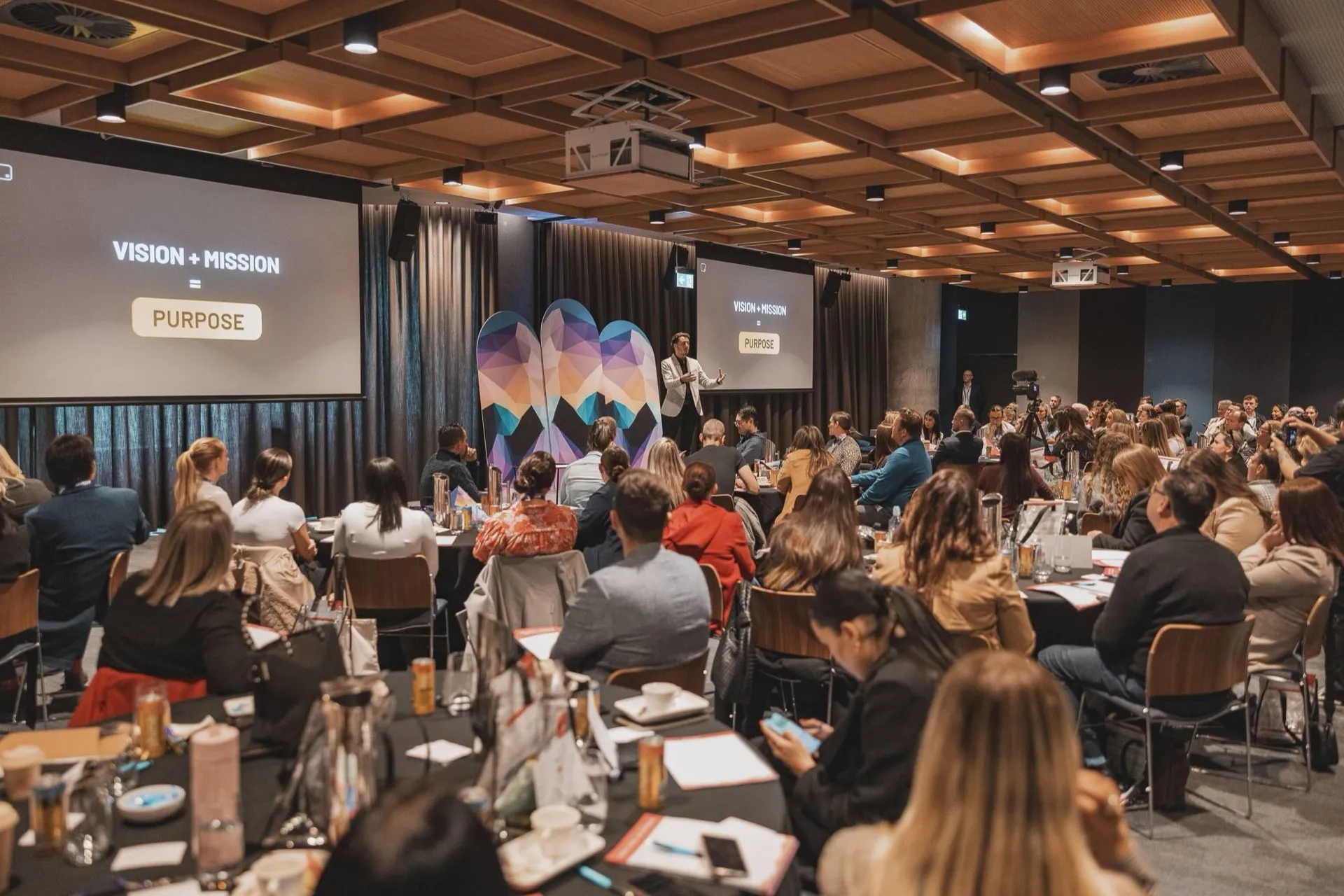 Joe Shannon presenting on stage at a BDM industry event