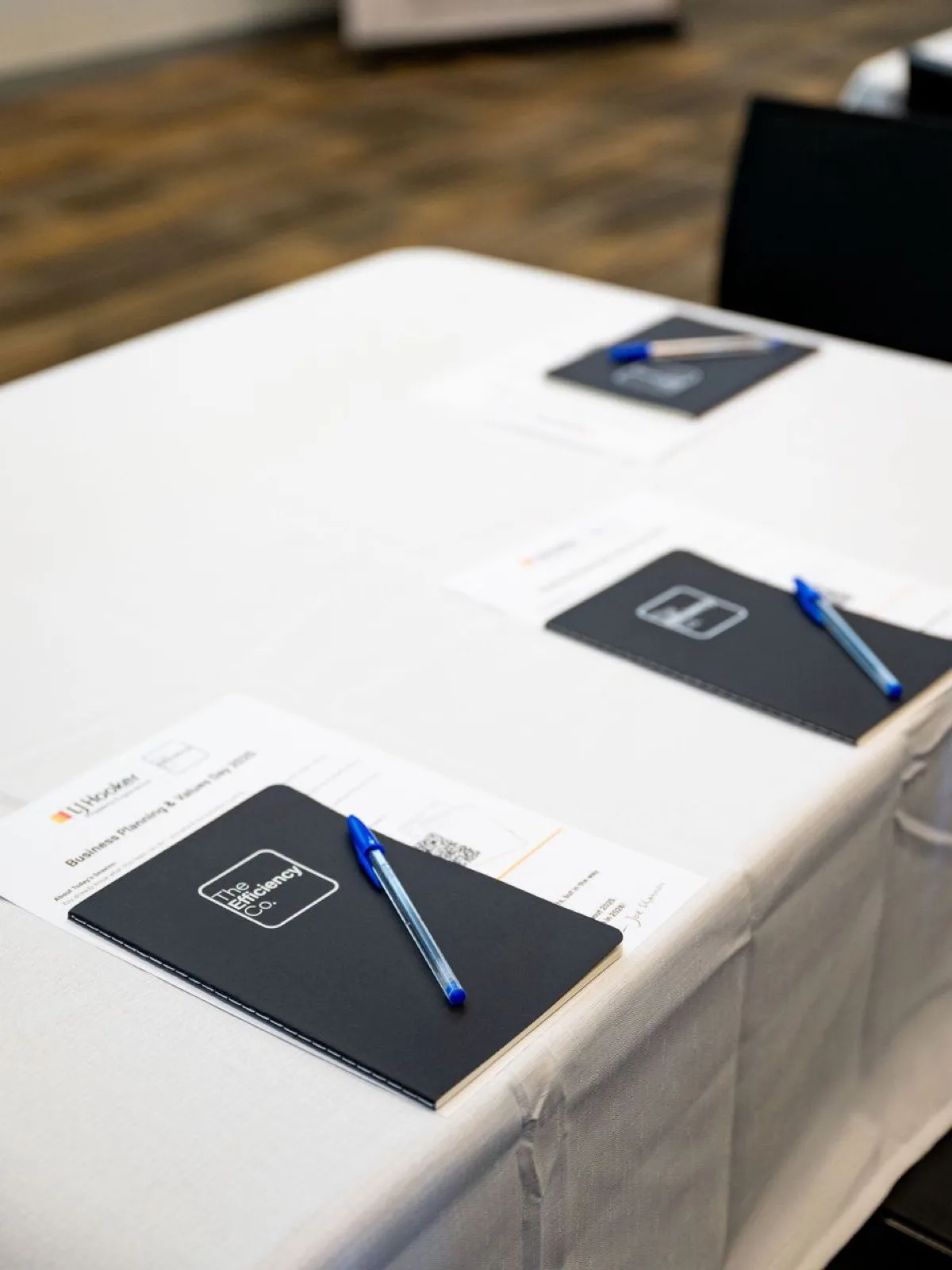 TEC workshop workbooks laid out on a table